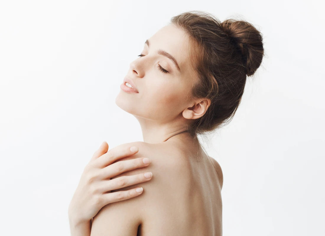 Woman with clean skin and relaxed expression after using antibacterial soap for body odor, underarm and armpit odor treatment